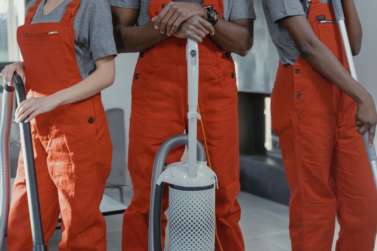 Cleaning team with professional equipment ready for a deep clean