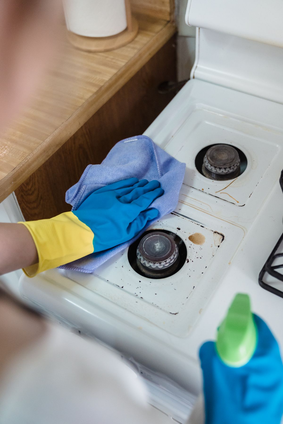 Deep cleaning a stove, removing built-up grime